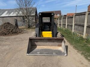1996 New Holland LX885 Turbo Skid steer c/w Bucket & Forks