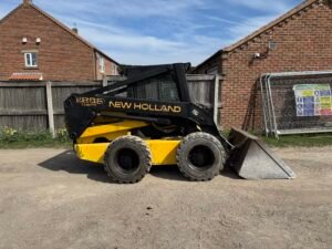 1996 New Holland LX885 Turbo Skid steer c/w Bucket & Forks