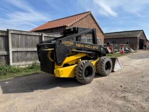 1996 New Holland LX885 Turbo Skid steer c/w Bucket & Forks