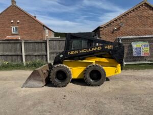 1996 New Holland LX885 Turbo Skid steer c/w Bucket & Forks
