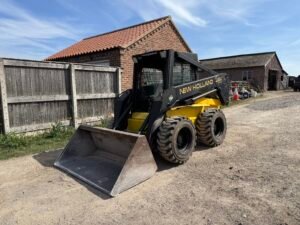 1996 New Holland LX885 Turbo Skid steer c/w Bucket & Forks